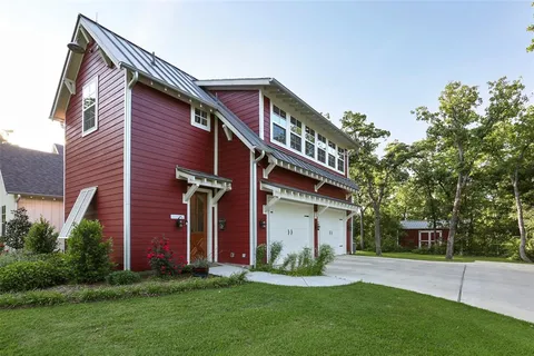 a front view of house with yard and green space