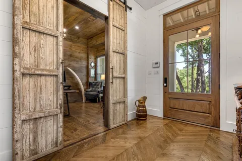 a view of a livingroom with furniture and staircase
