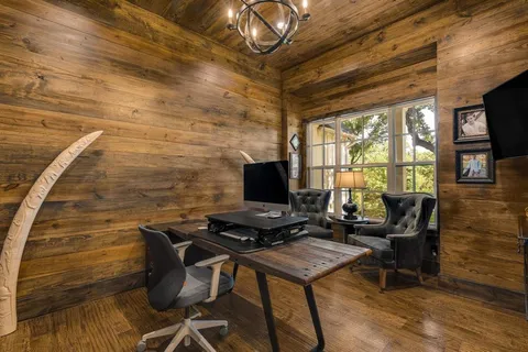 a view of a workspace with furniture