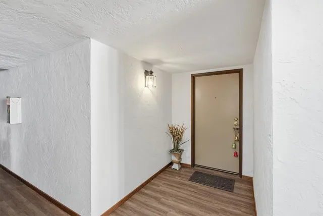 a view of an empty room with bathroom