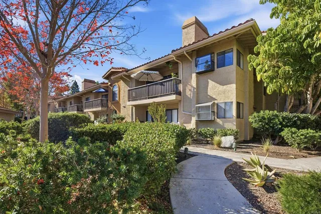a view of multiple houses with a yard