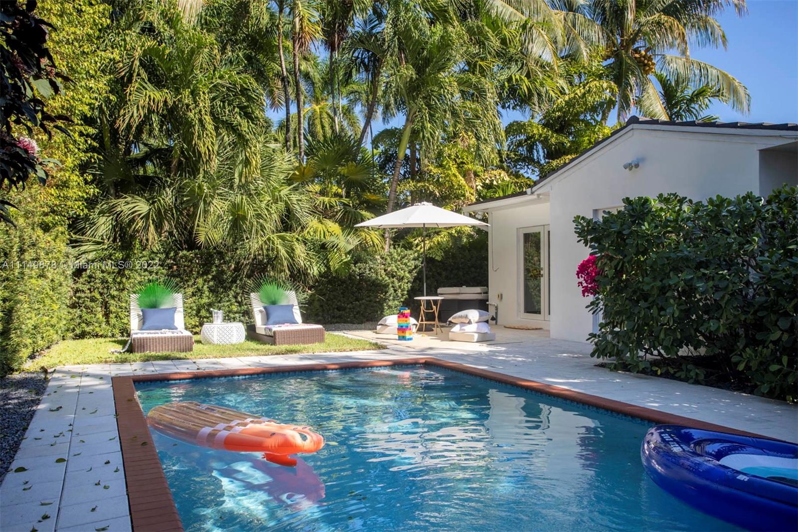 3020 Alton Road Miami Beach, FL 33140 - Photo 18 of 22 swimming pool view with a seating space