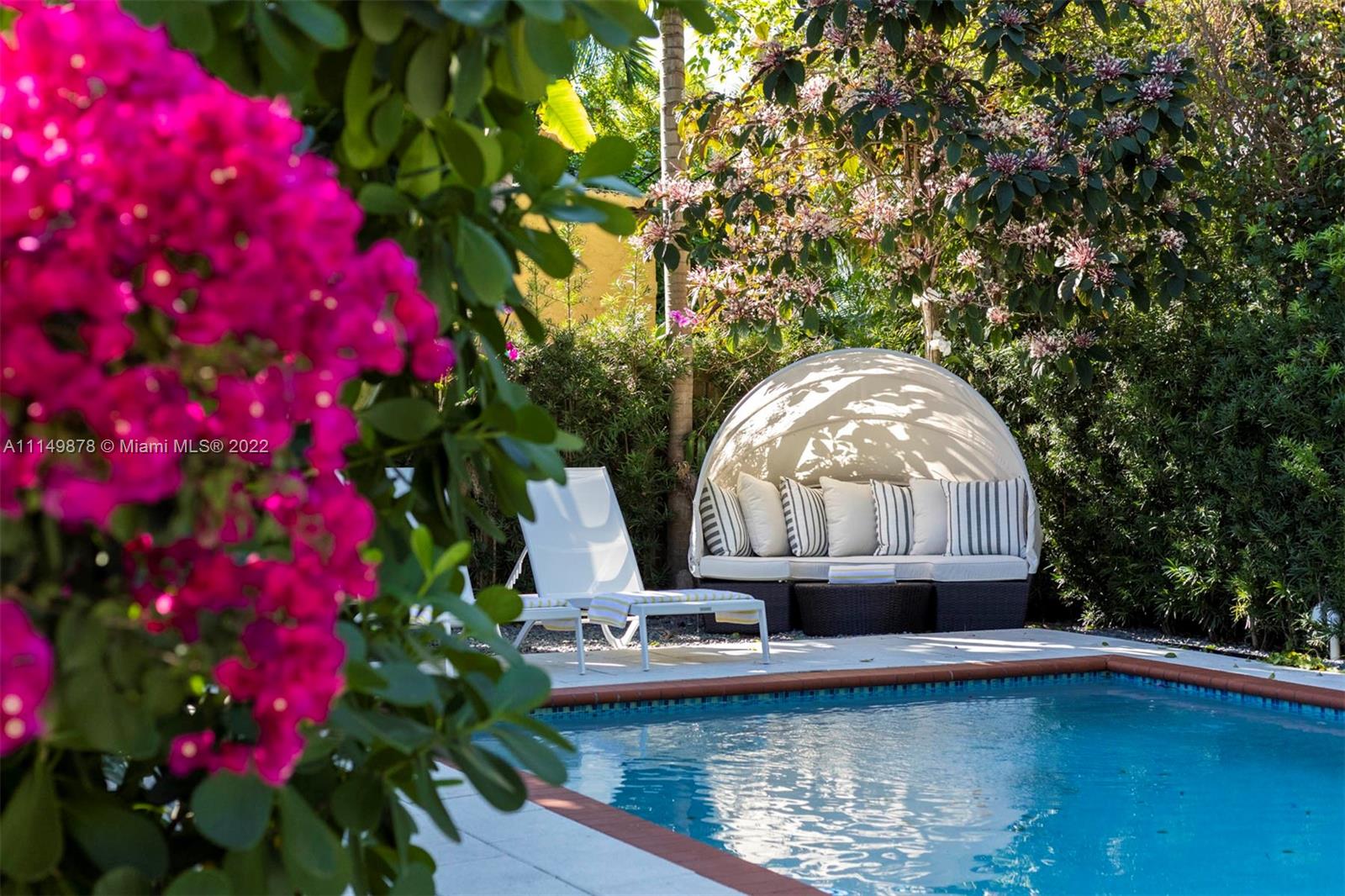 3020 Alton Road Miami Beach, FL 33140 - Photo 21 of 22 a front view of house with yard