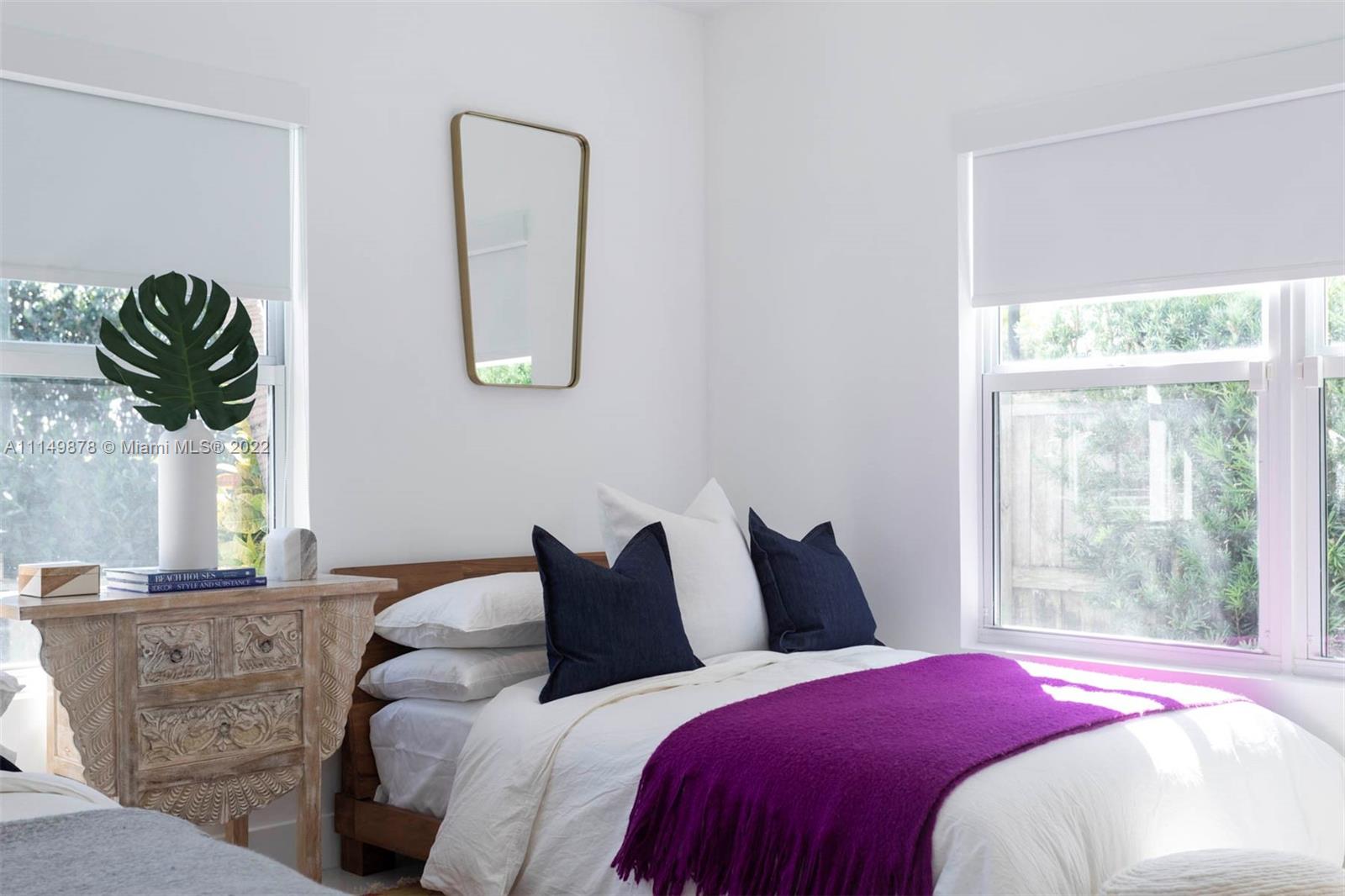 3020 Alton Road Miami Beach, FL 33140 - Photo 22 of 22 a bedroom with bed and a window