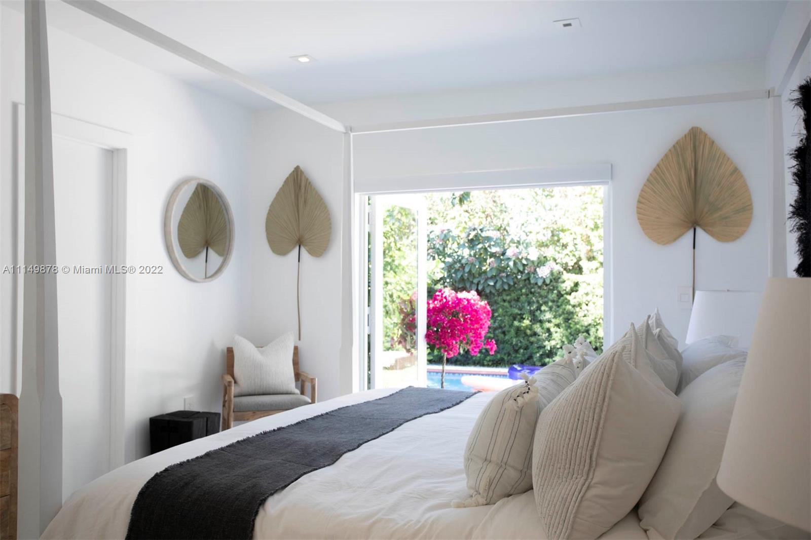 3020 Alton Road Miami Beach, FL 33140 - Photo 6 of 22 a bedroom with a bed and a window