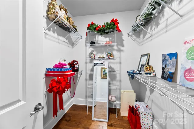 a bathroom with a sink a toilet a mirror and shower
