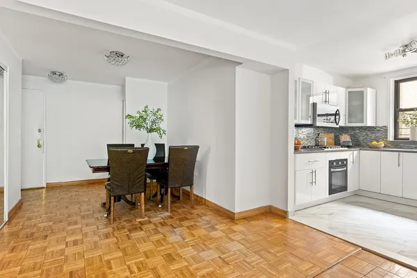 a view of kitchen with cabinets and wooden floor