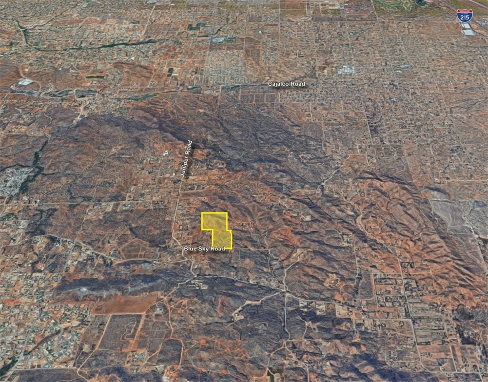 1 Blue Sky Road Perris, CA 92570 - Photo 3 of 6 a view of a dry yard with wooden fence