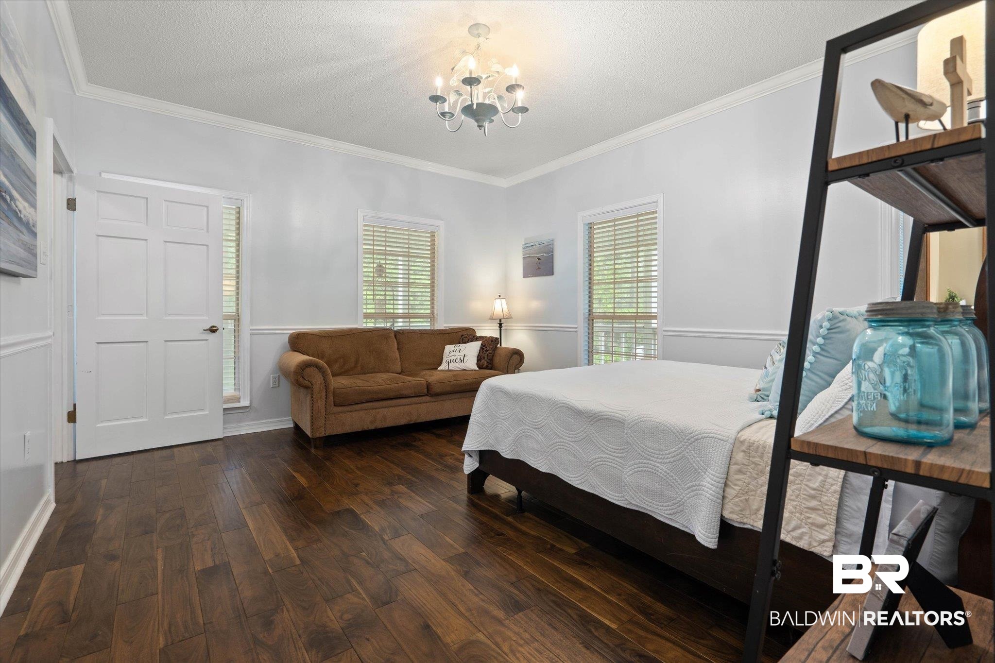 2300 Radcliff Road Saraland, AL 36571 - Photo 14 of 56 Bedroom featuring dark wood-style flooring, a chandelier, and ornamental molding