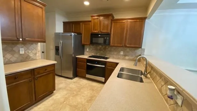 a view of a room with wooden floor fireplace and a window