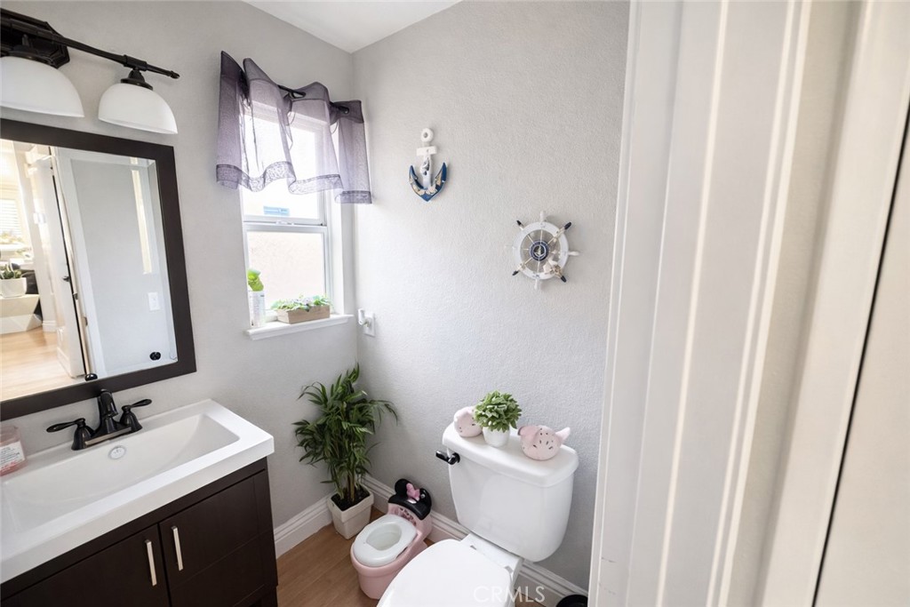 19972 Windwood Circle Riverside, CA 92508 - Photo 14 of 17 a bathroom with a sink toilet and shower