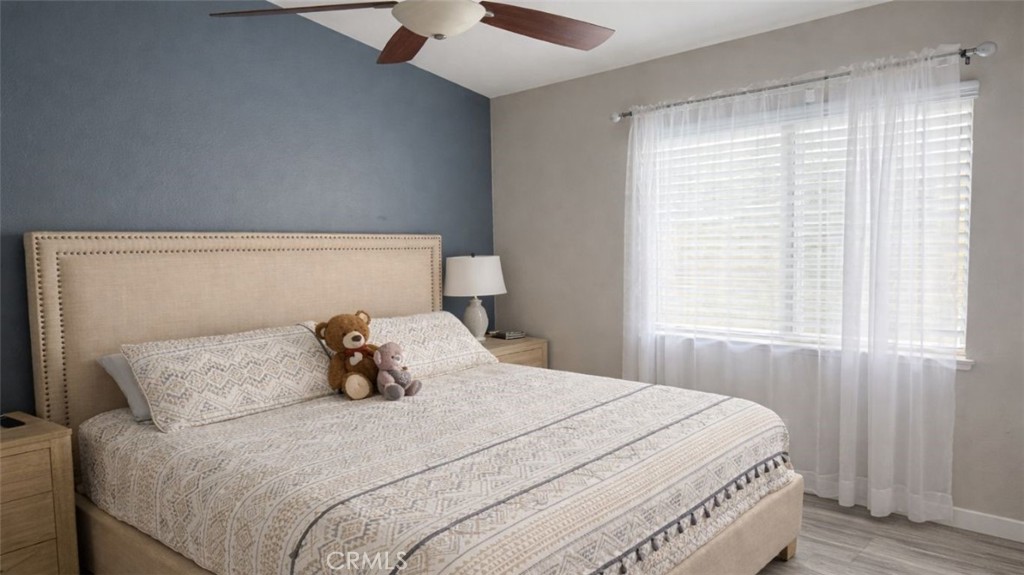 19972 Windwood Circle Riverside, CA 92508 - Photo 15 of 17 a bedroom with a bed and window