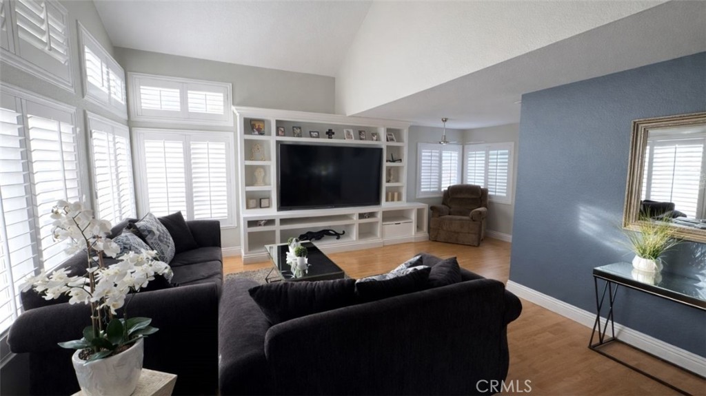 19972 Windwood Circle Riverside, CA 92508 - Photo 2 of 11 a living room with furniture and a flat screen tv