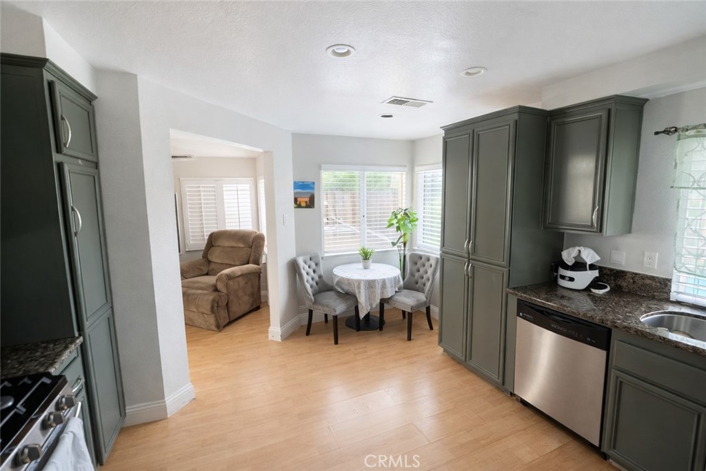 19972 Windwood Circle Riverside, CA 92508 - Photo 5 of 17 a kitchen with a refrigerator and a stove