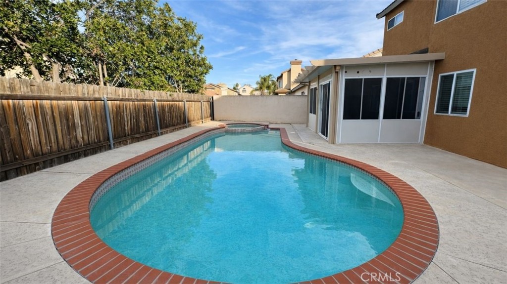 19972 Windwood Circle Riverside, CA 92508 - Photo 10 of 17 a view of a swimming pool with a sitting area