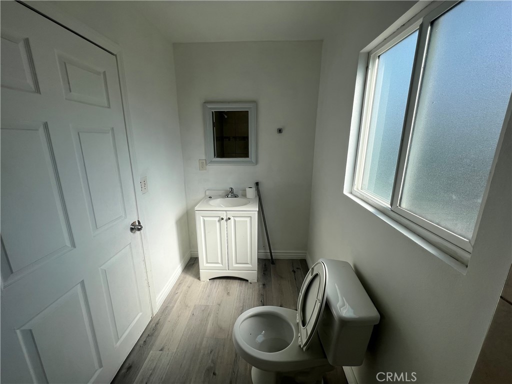 1582 Ricardo Street Los Angeles, CA 90033 - Photo 13 of 27 a living room with furniture and a wooden floor