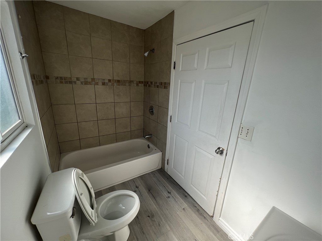 1582 Ricardo Street Los Angeles, CA 90033 - Photo 14 of 27 a bathroom with a tub a toilet and a shower