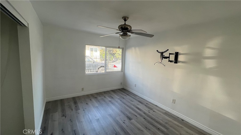 1582 Ricardo Street Los Angeles, CA 90033 - Photo 16 of 27 an empty room with a window and a ceiling fan