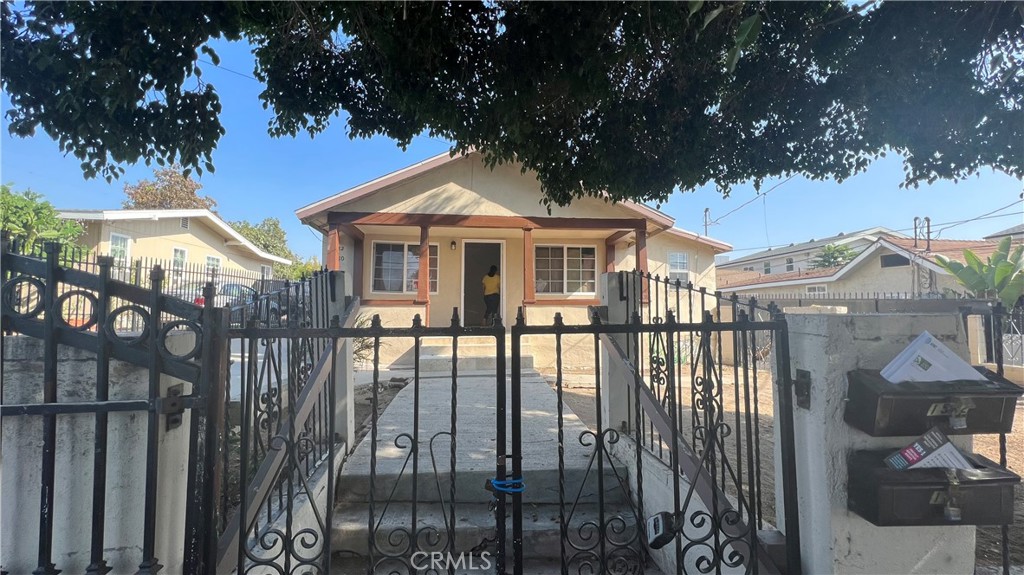 1582 Ricardo Street Los Angeles, CA 90033 - Photo 2 of 27 a front view of a house with balcony