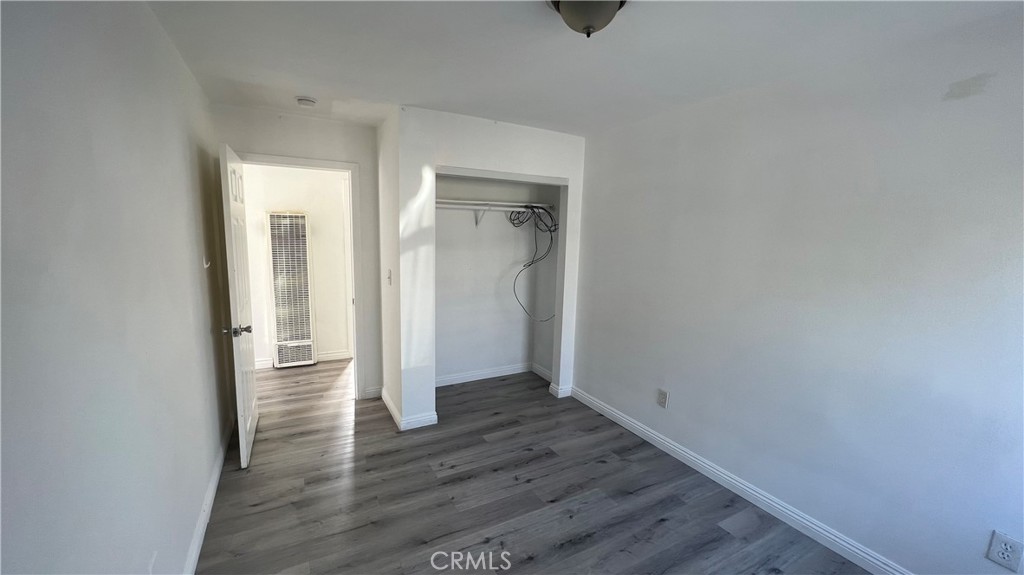 1582 Ricardo Street Los Angeles, CA 90033 - Photo 21 of 27 an empty room with wooden floor and a window