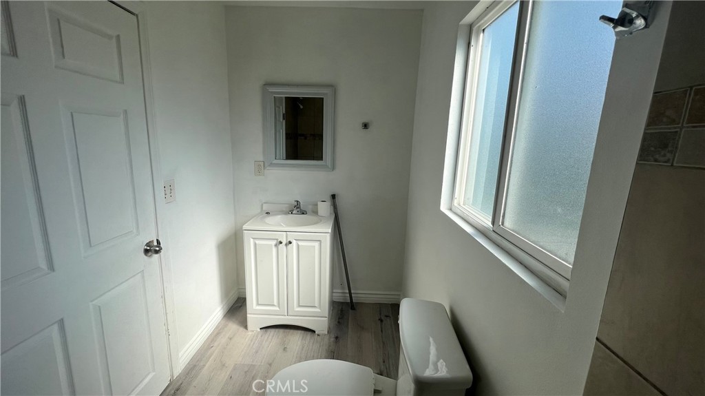 1582 Ricardo Street Los Angeles, CA 90033 - Photo 23 of 27 a view of a hallway with wooden floor and cabinet