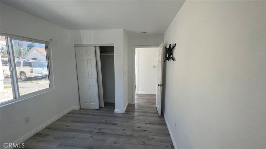 1582 Ricardo Street Los Angeles, CA 90033 - Photo 24 of 27 a view of a hallway with wooden floor and a bathroom