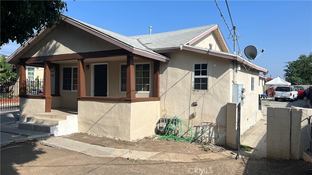 1582 Ricardo Street Los Angeles, CA 90033 - Photo 6 of 27 a front view of a house with a yard