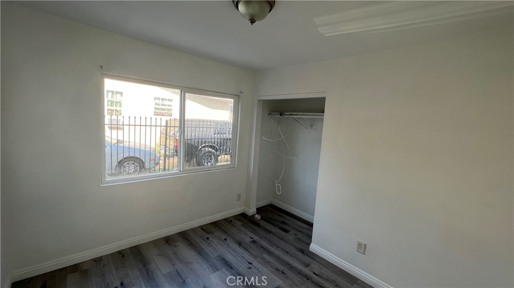 1582 Ricardo Street Los Angeles, CA 90033 - Photo 8 of 27 a view of an empty room with wooden floor and a window