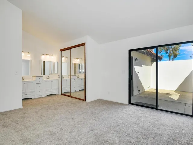 an empty room with a view of balcony