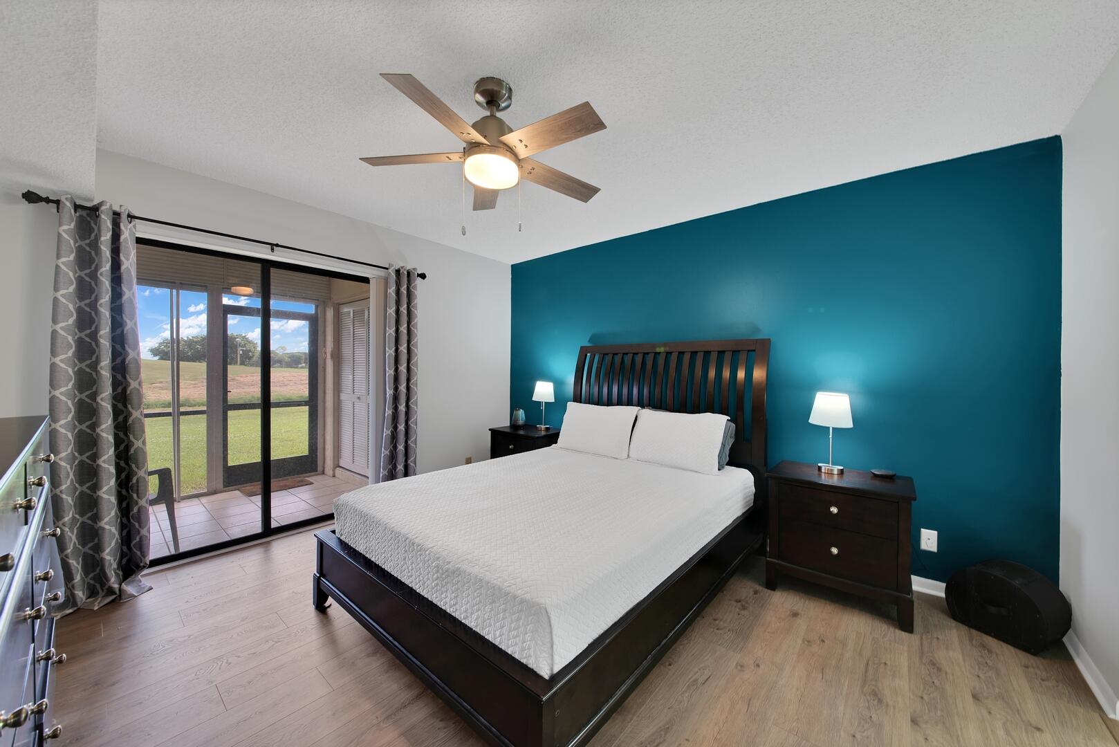 4708 Lucerne Lakes Boulevard East, Unit 104 Lake Worth, FL 33467 - Photo 10 of 28 a bedroom with a bed and a large window