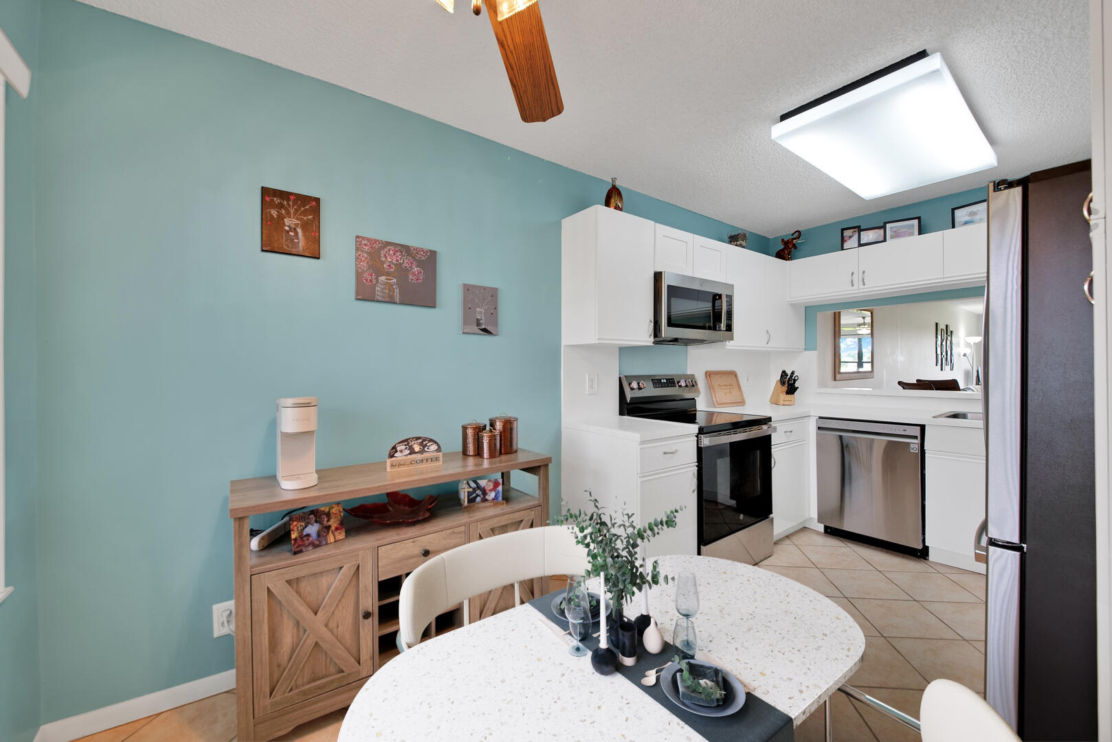 4708 Lucerne Lakes Boulevard East, Unit 104 Lake Worth, FL 33467 - Photo 15 of 28 a kitchen with a sink stove and refrigerator