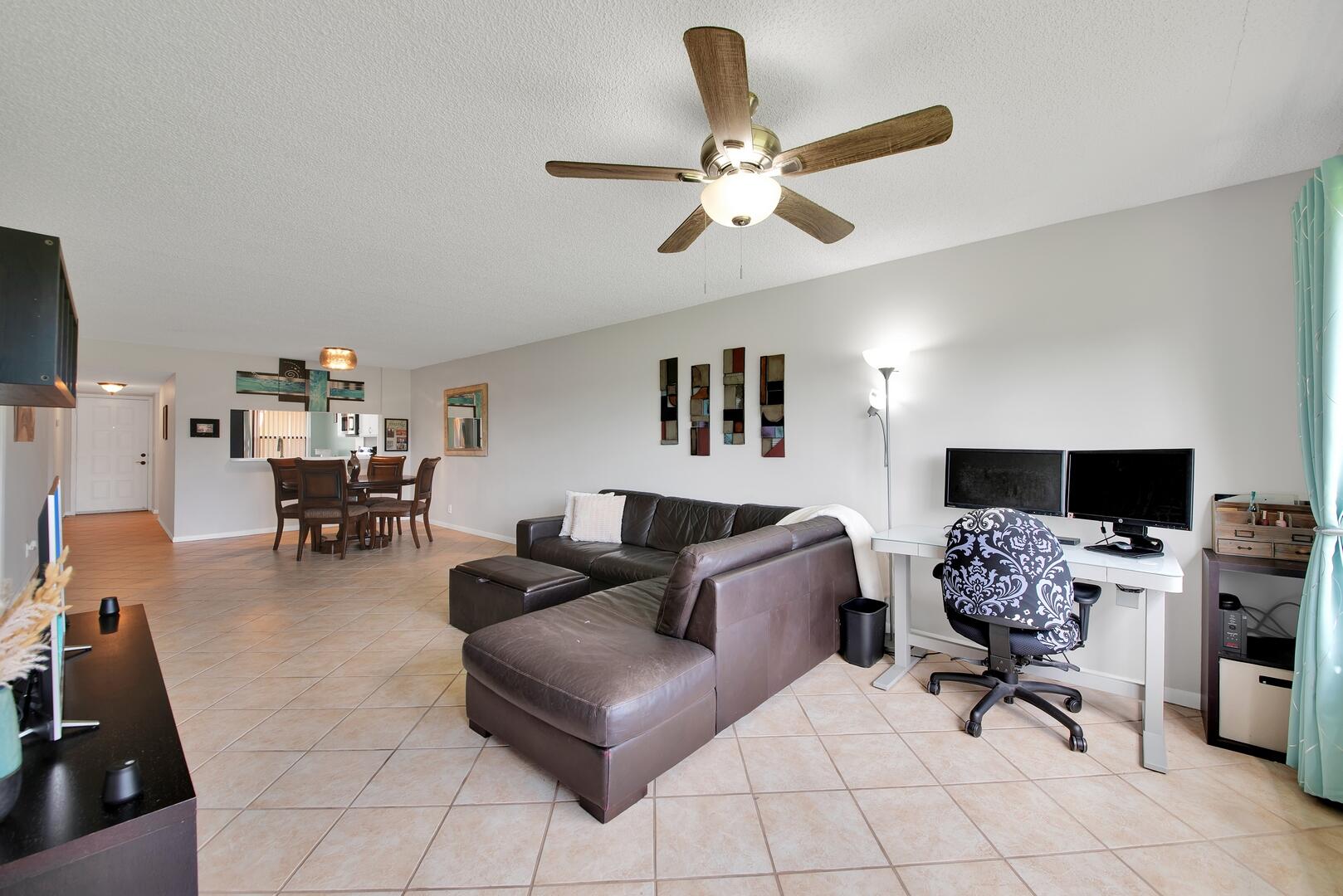 4708 Lucerne Lakes Boulevard East, Unit 104 Lake Worth, FL 33467 - Photo 28 of 28 a living room with furniture