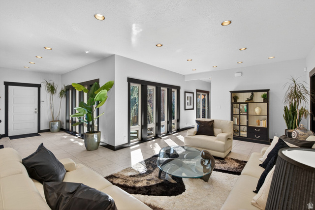 145 Carnesecca Court Mapleton, UT 84664 - Photo 10 of 109 Living room featuring recessed lighting and light tile patterned floors