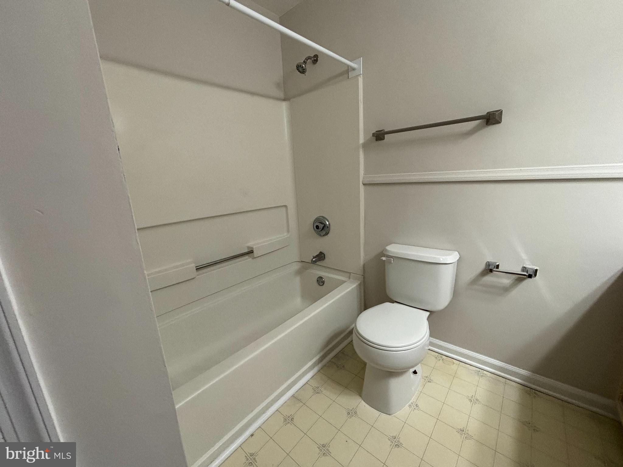 27 Gristmill Lane Pine Hill, NJ 08021 - Photo 15 of 19 a white toilet sitting next to a bath tub and a shower