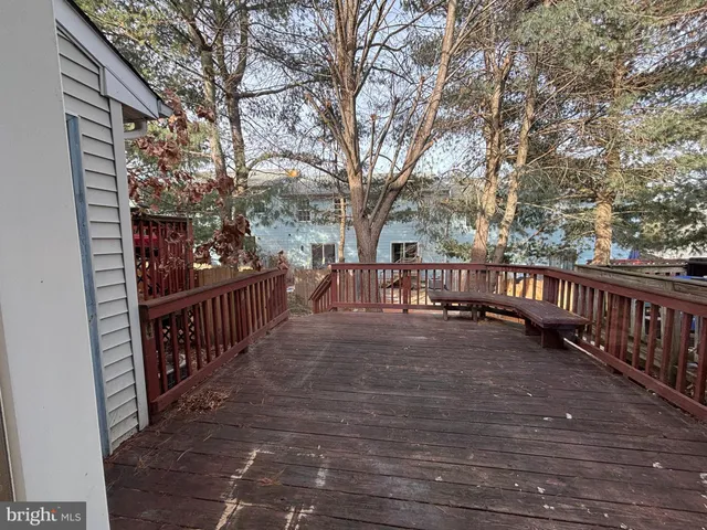 a view of street with wooden deck