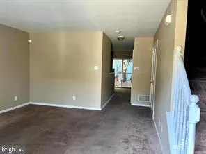 a view of a hallway with wooden shelves