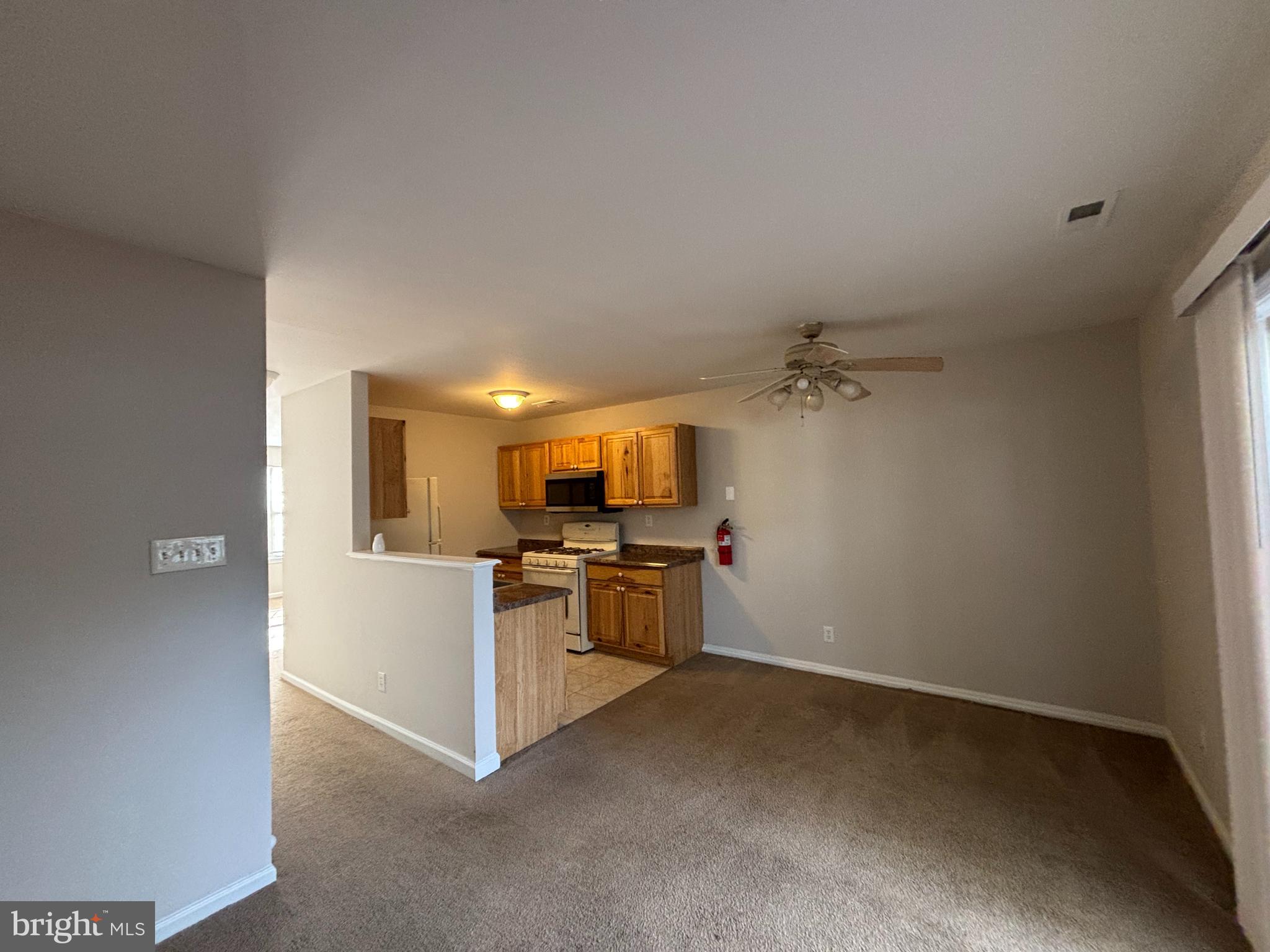 27 Gristmill Lane Pine Hill, NJ 08021 - Photo 5 of 19 a kitchen with a stove and a refrigerator