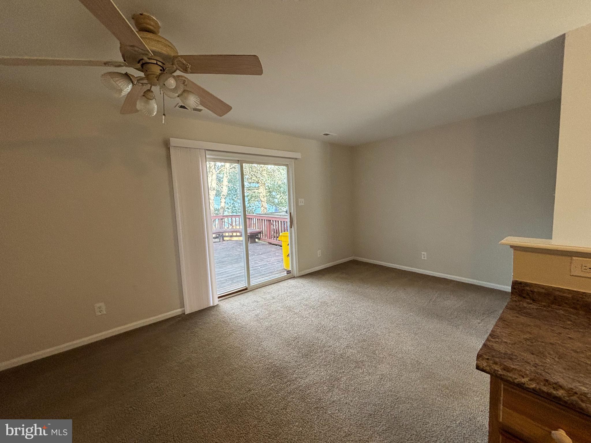 27 Gristmill Lane Pine Hill, NJ 08021 - Photo 6 of 19 a view of an empty room and a window