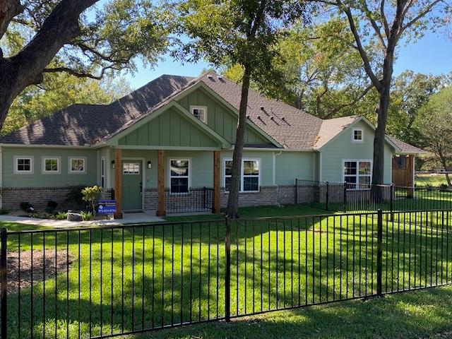 403 South 6th Street, Unit B Midlothian, TX 76065 - Photo 1 of 9 a front view of a house with a yard table and chairs