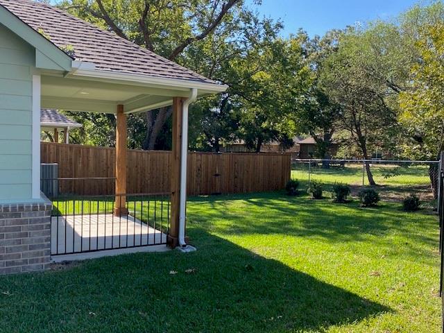 403 South 6th Street, Unit B Midlothian, TX 76065 - Photo 3 of 9 a view of a house with a yard