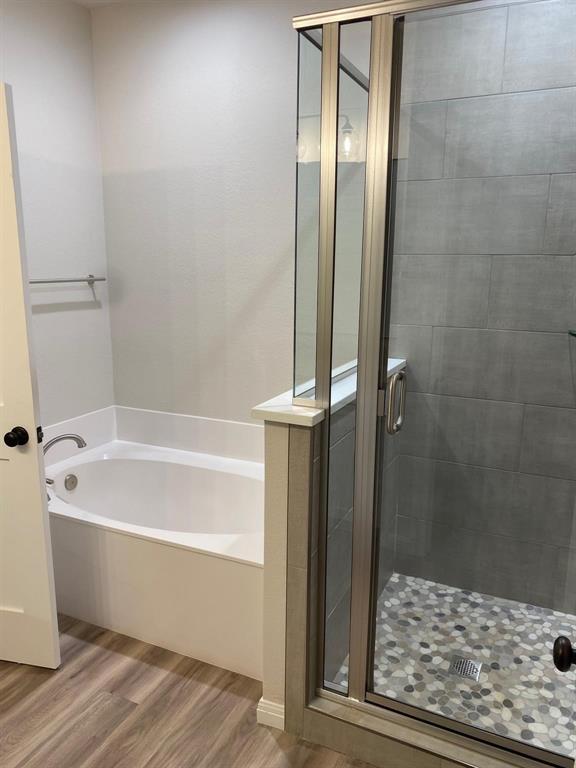 403 South 6th Street, Unit B Midlothian, TX 76065 - Photo 7 of 9 a bathroom with a bathtub and a shower