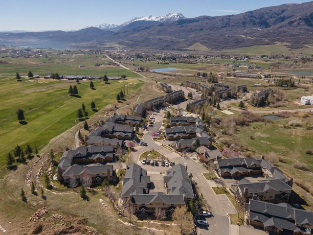 5168 Fairview Loop, Unit C604 Eden, UT 84310 - Photo 41 of 53 Aerial overview of property's location with a water and mountain view, nearby suburban area, and a local golf course