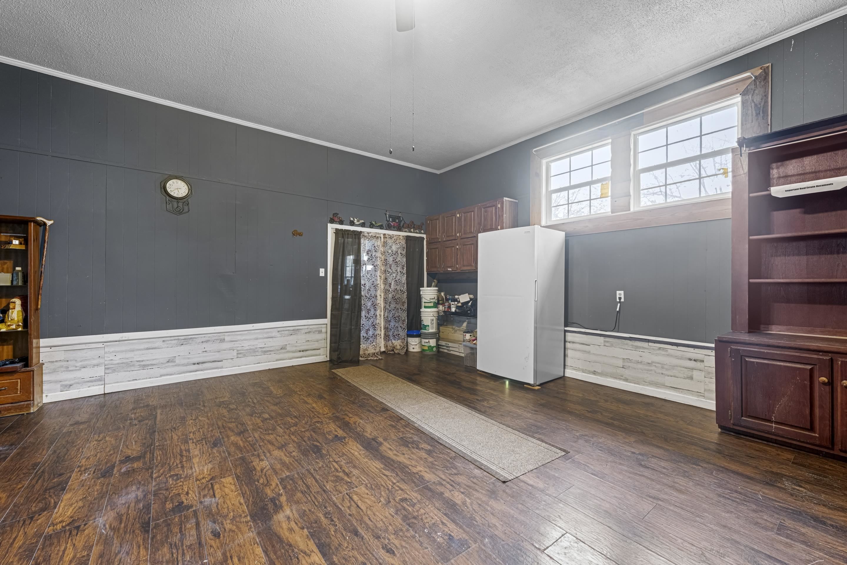 754 McWilliams Road Covington, TN 38019 - Photo 11 of 28 an empty room with wooden floor and windows