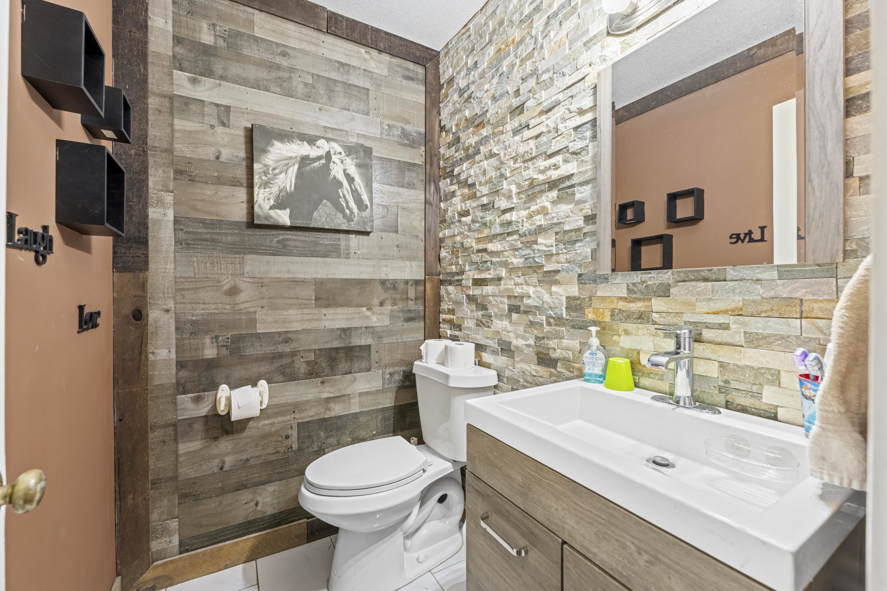 754 McWilliams Road Covington, TN 38019 - Photo 12 of 28 a bathroom with a sink a toilet and shower