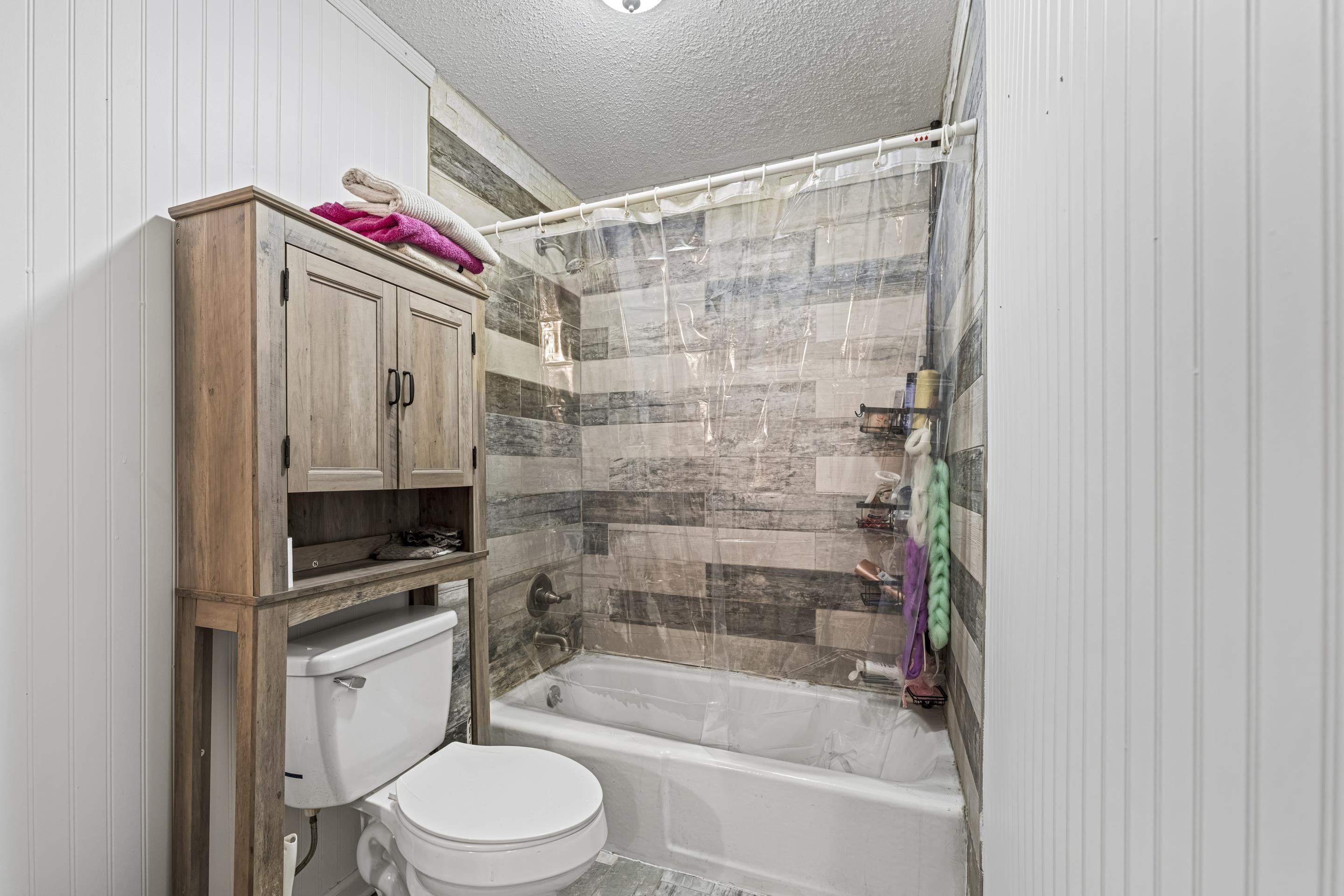 754 McWilliams Road Covington, TN 38019 - Photo 18 of 28 a bathroom with a toilet and a shower