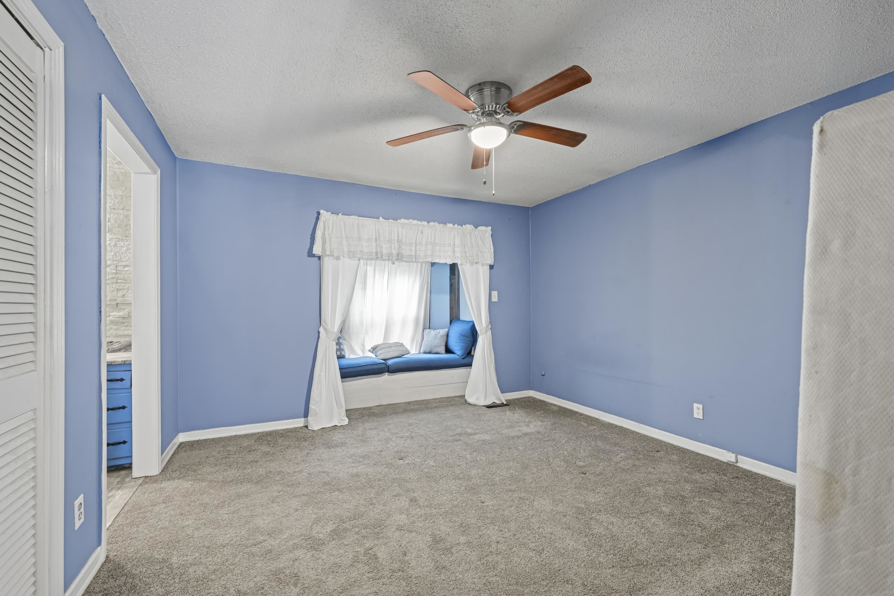 754 McWilliams Road Covington, TN 38019 - Photo 24 of 28 an empty room with closet and fan