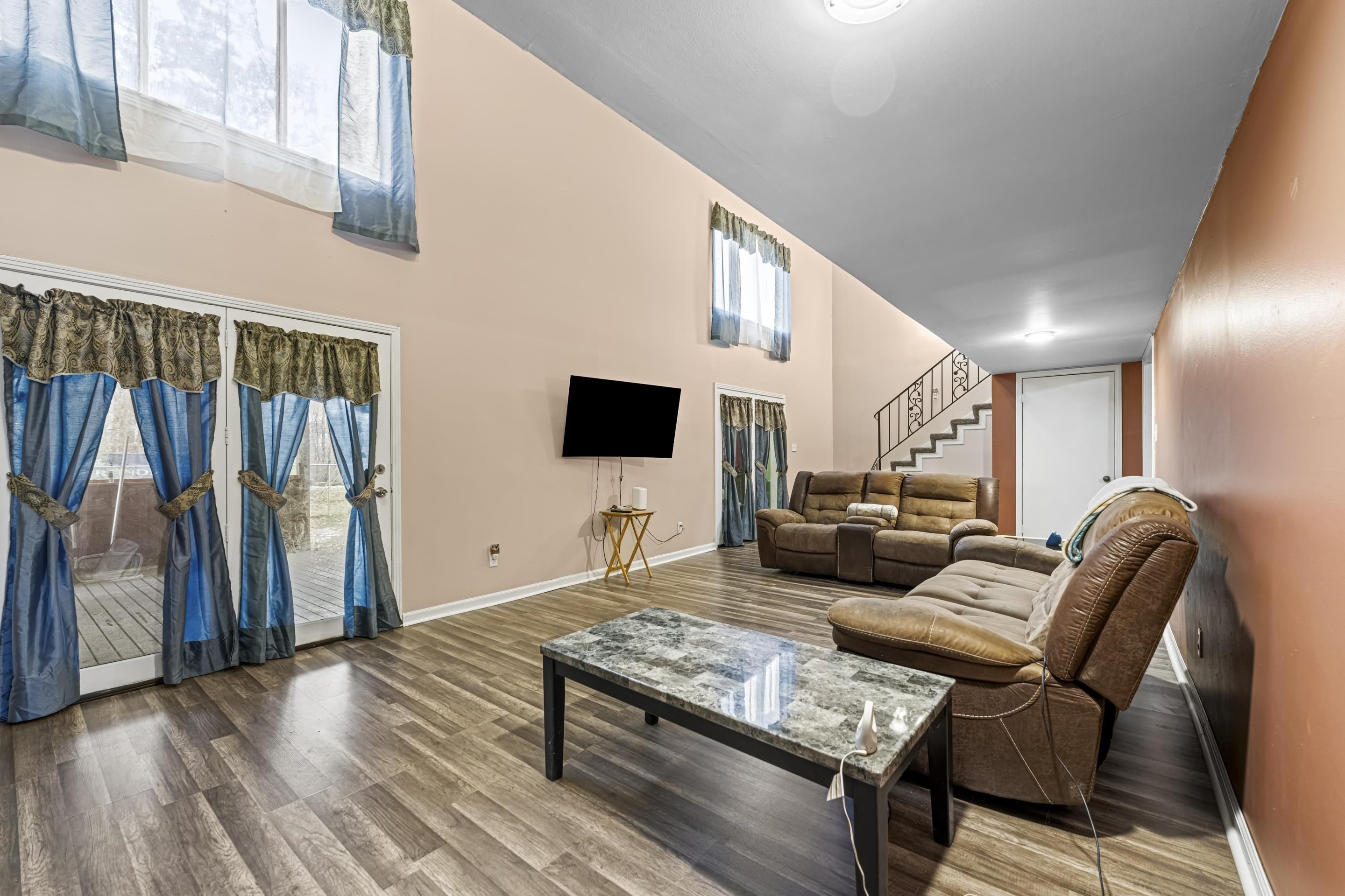 754 McWilliams Road Covington, TN 38019 - Photo 6 of 28 a living room with furniture and a flat screen tv