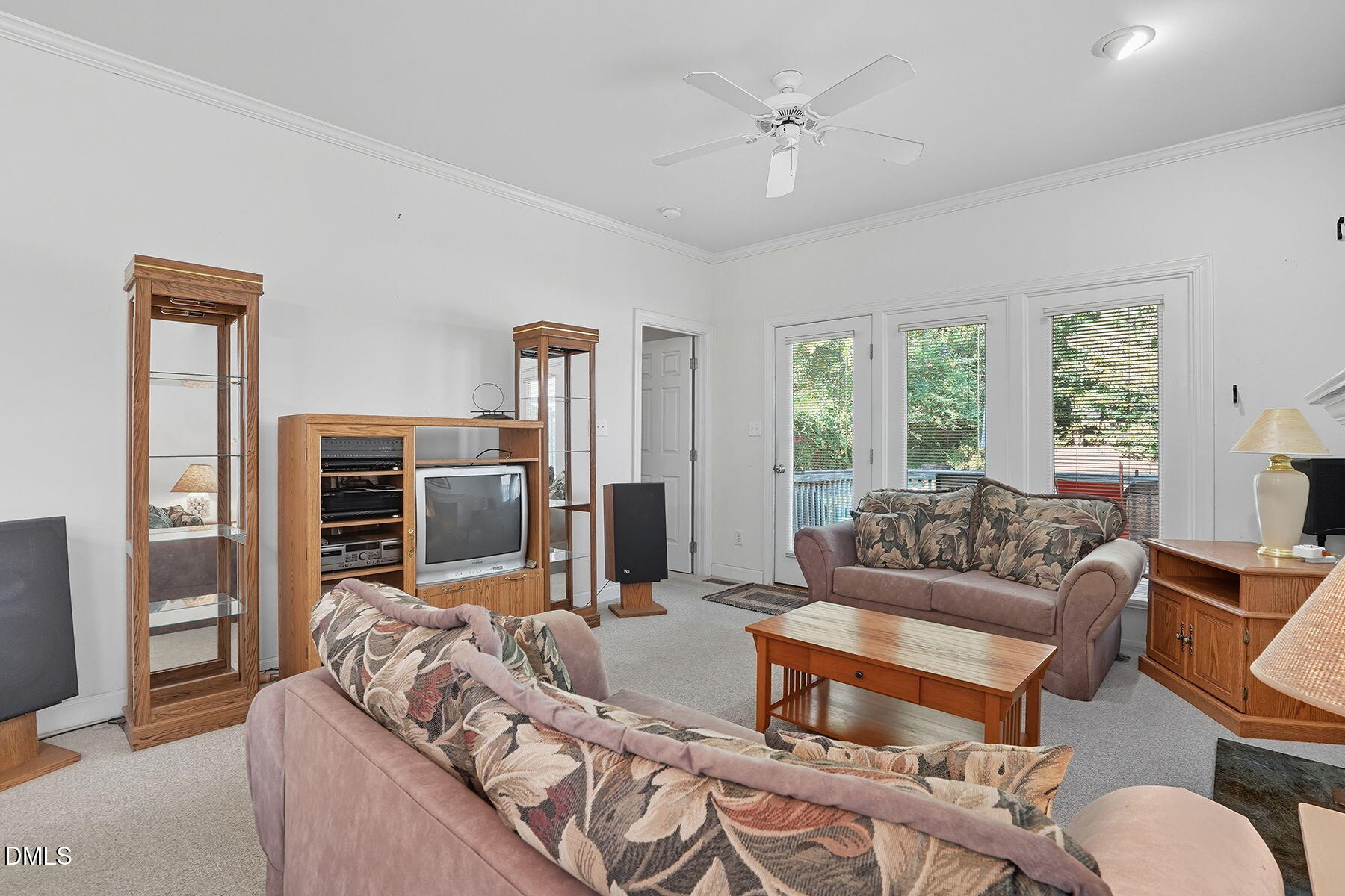 2029 Castle Pines Drive Raleigh, NC 27604 - Photo 11 of 38 a living room with furniture flat screen tv and large window