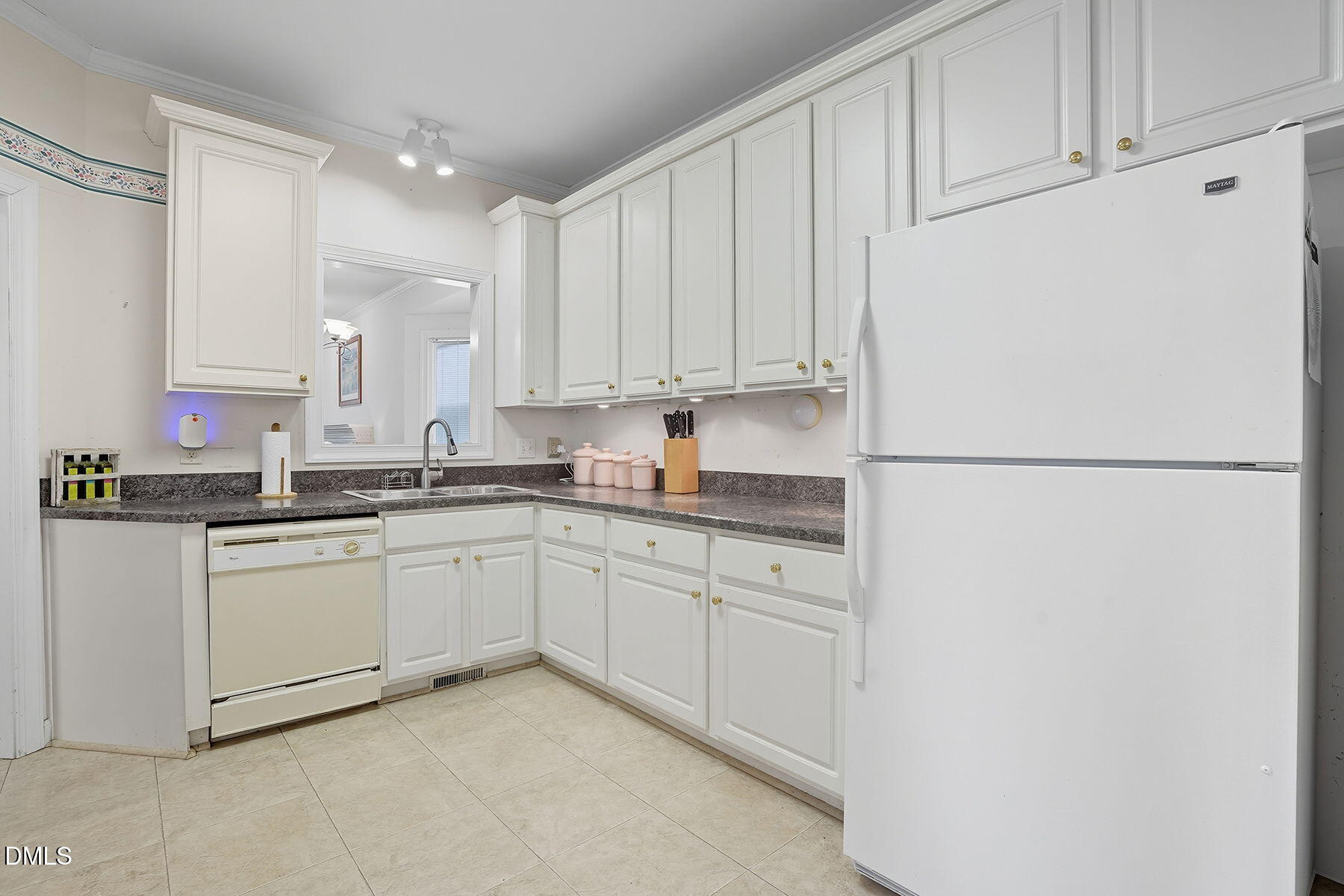 2029 Castle Pines Drive Raleigh, NC 27604 - Photo 15 of 38 a kitchen with cabinets appliances a sink and a counter top space