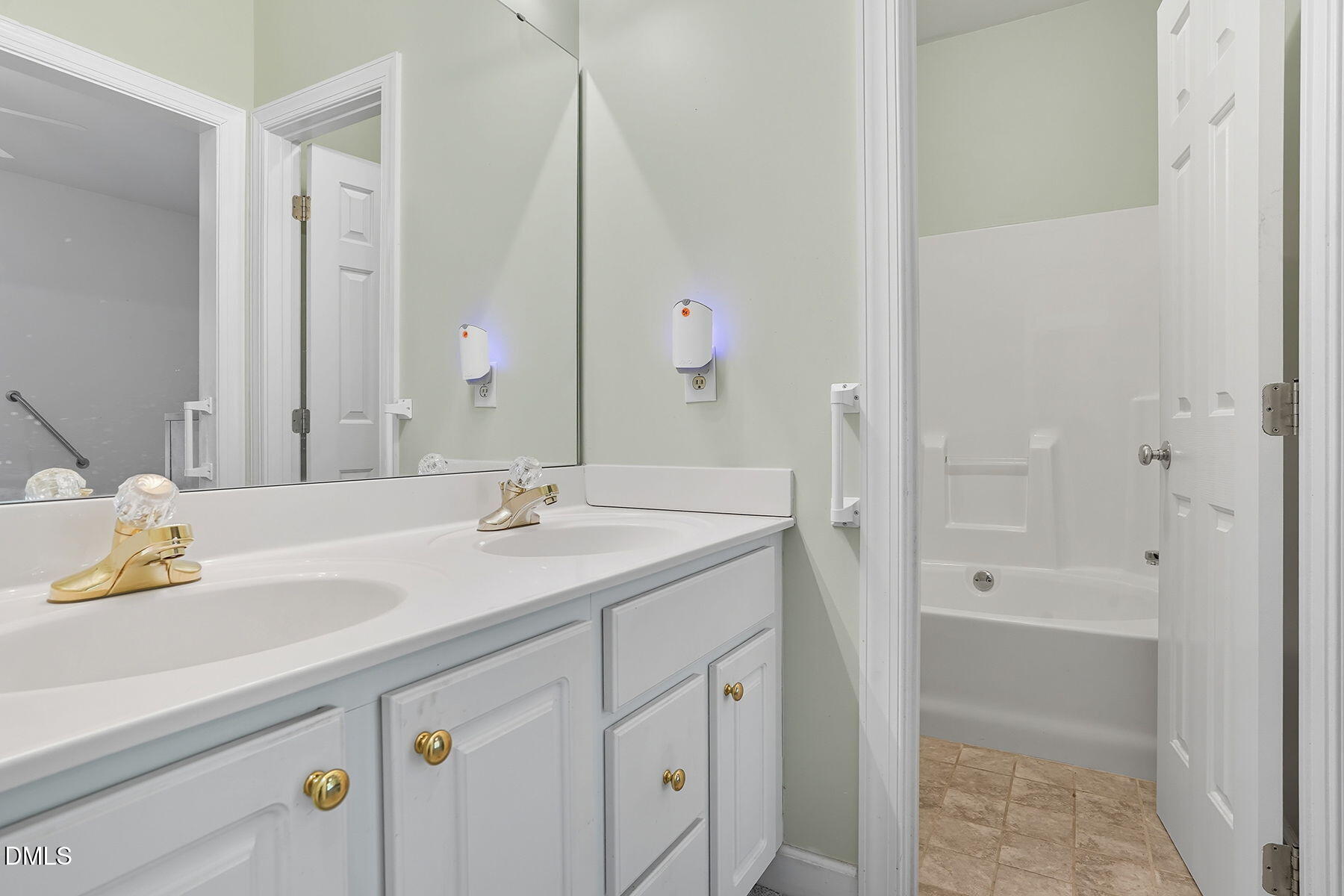 2029 Castle Pines Drive Raleigh, NC 27604 - Photo 24 of 38 a bathroom with a sink and a mirror